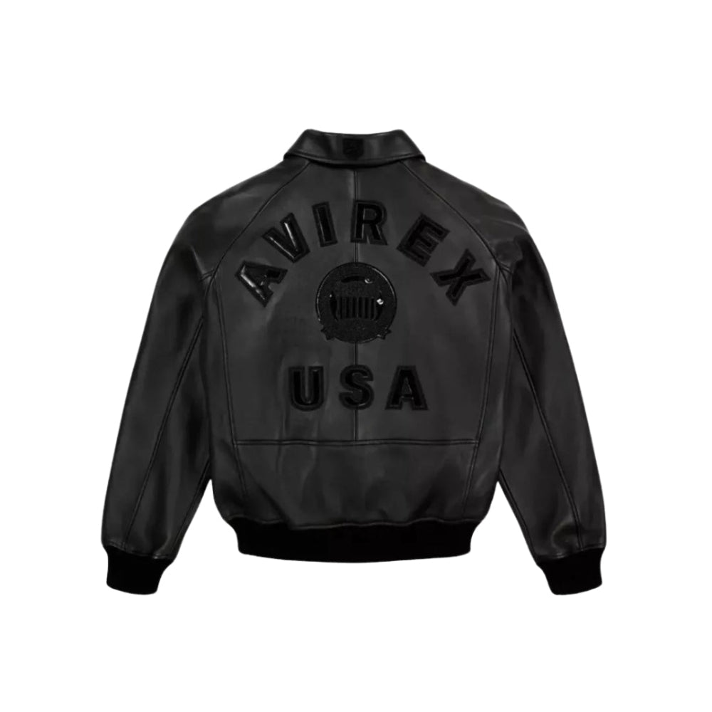 Avirex men's black leather bomber jacket with 'AVIREX' and 'USA' text embroidered on the back, featured on a white background with a 'LEATHERCORE' label at the top.